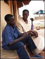 Christine Oroma, a counselor at the Children of War Rehabilitation Center in Gulu, in northern Uganda, talks with Richard Odong, 15, a former child fighter. "When I'm here, I'm paining less over my terrible acts," Richard said.  Photo: Emily Wax/Washington Post