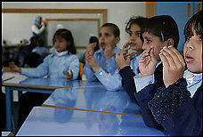 First-graders at a Gaza school for the deaf have had to rely on sign language since Israeli import restrictions caused the school to run seriously low on hearing-aid batteries. The isolated strip is also short of antibiotics, fuel and food. Scott Wilson/Washington Post