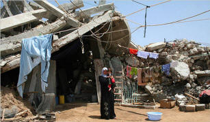 Four months after Israel�s war against Hamas in Gaza, Suad Khadir and her family are still living in a tent. To escape the heat, they often seek refuge under the rubble. Photo: Ashraf Amra./New York Times