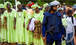 Supporters rallied Thursday for Malam Bacai Sanh�, a candidate in Guinea-Bissau, where the threat of violence haunts daily life. Photo: Joe Penney/Reuters