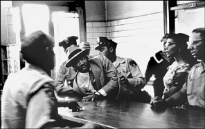 Charles Moore photographed the Rev. Martin Luther King Jr.'s 1958 arrest in Montgomery, Ala. King's wife, Coretta, is second from right. Photo: (� Charles Moore/Black Star) 