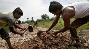 Villagers work at a road construction site under a government program in Andhra Pradesh, India. In decades past, fraud and waste have sapped efforts to help the poor. Rajiv Gandhi, a former prime minister, famously estimated that only 15 percent of every rupee spent on the poor actually reached them. Photo: Kuni Takahashi/New York Times &nbsp;
