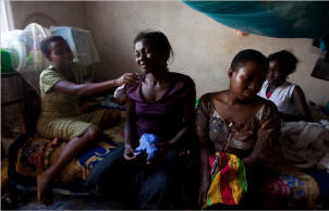 Dinavance Kamukama, 28, front right, with her cousins in Kampala, Uganda. She is on a waiting list for AIDS medication. Uganda is the first country where major clinics routinely turn people away, but it will not be the last. In Kenya next door, grants to keep 200,000 on drugs will expire soon. An American-run program in Mozambique has been told to stop opening clinics. 
There have been drug shortages in Nigeria and Swaziland. Tanzania and Botswana are trimming treatment slots, according to a report by the medical charity Doctors Without Borders. 