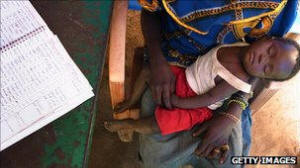 Mother with sick child. Malaria accounts for 20% of childhood deaths in Africa. Photo: Getty Images