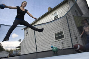 Teenage woman on trampoline. In a Rust Belt town, a teenager�s climb from poverty: Tabitha Rouzzo yearns to take a different path than those around her in New Castle, Pa., but leaving poverty requires a more exhaustive effort than it once did in America. Photo: Linda Davidson/Washington Post&nbsp;
