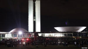 Protesters gathered outside the National Congress building in Brasilia and climbed on the roof. Photo: Reuters 