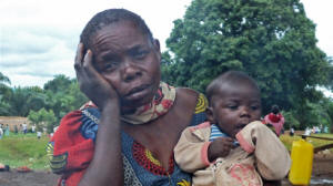Mathotine Dz'dai, with her orphaned granddaughter, who recently fled clashes in the northeast DRC town of Bavi, in Ituri district. Photo: Richard Pituwa/IRIN