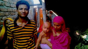 Al-Amin and Fatima outside their new home in a slum in Dhaka. Photo: Mubashar Hasan/IRIN