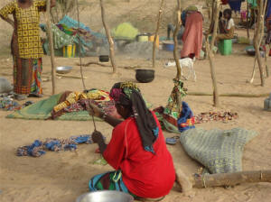 A displaced woman sets up camp in Mali's Timbuktu region. Photo: Africare