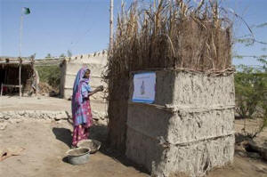 In this March 3, 2015 photo, a Pakistani villager builds a toilet in Thatta district. Photo: Associated Press