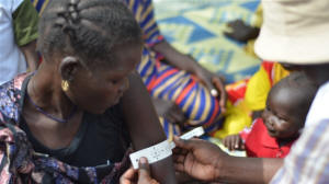 A South Sudanese woman has  the circumference of her upper arm taken, which  is a measure of malnutrition. Photo: Jason Patinkin/IRIN